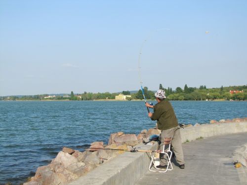 angler fishing rods water