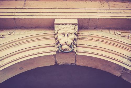 archway lion head stone