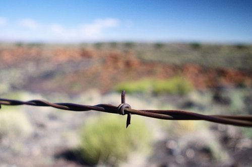arizona barbed wire  sunset  crater