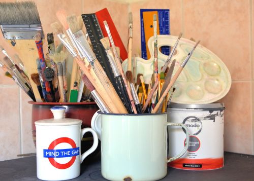art mediums paint brushes containers
