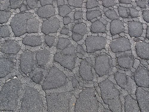 asphalt surface torn