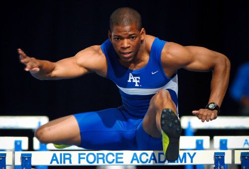 athlete running hurdles