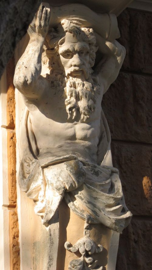 atlas facade stone figure