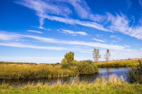 autumn pond clouds