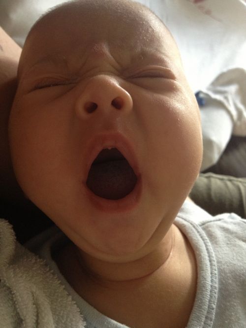 baby yawning tired