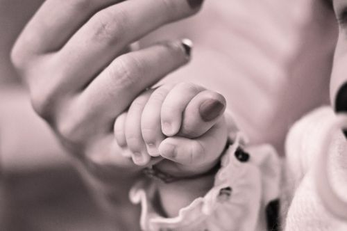 baby hand holding