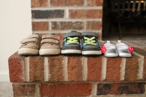 baby announcement shoes fireplace