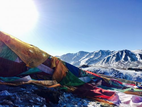 backlighting tibetan snow mountain