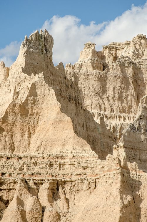 badlands rock formations blue sky