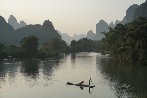 bamboo raft  yulong river  sunset