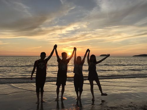 beach hand sunset