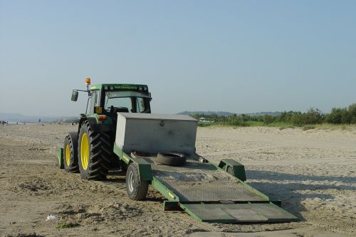 beach tractor cleaning beaches