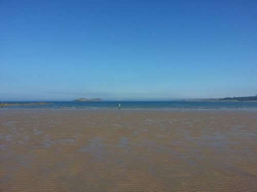 beach in scotland tide out blue sky