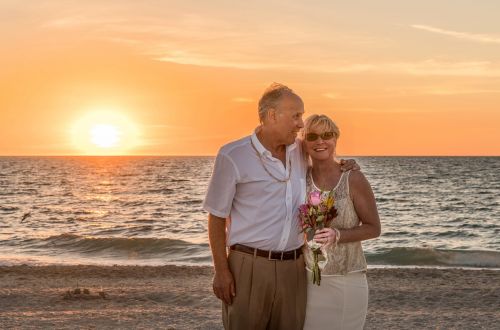 beach wedding happy couple sunset