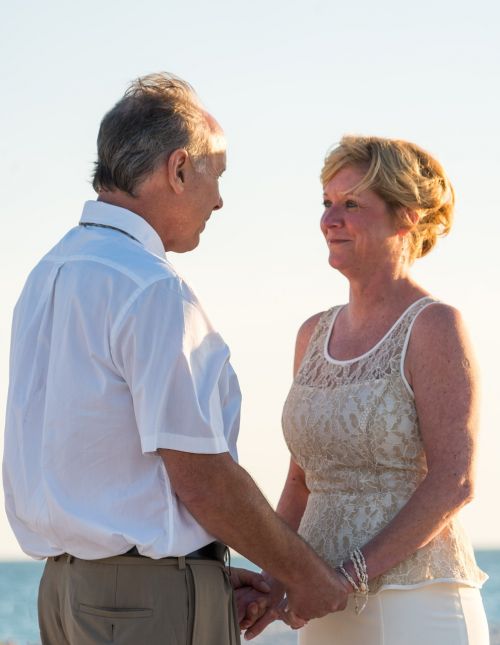 beach wedding happy couple sunset