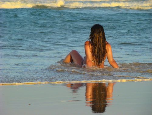beautiful women beach waves