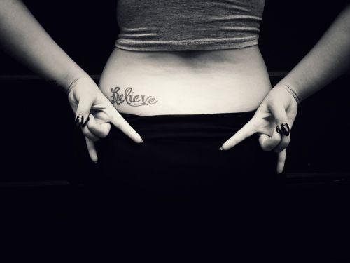 believe tattoo girl