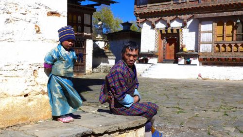 bhutan child with father resting