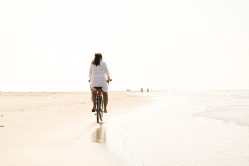 bicycle beach woman