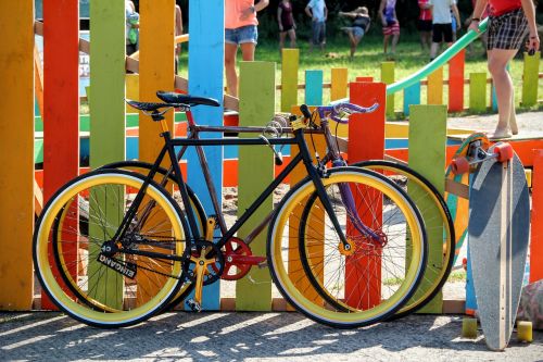 bicycles colorful garden fence