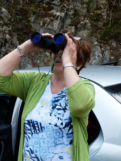 binoculars observation woman