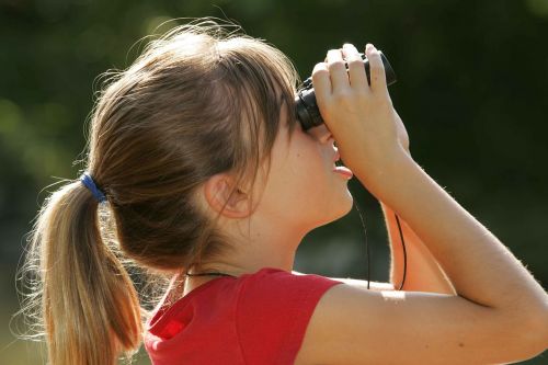 binoculars watching girl