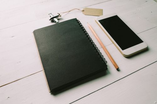 black notebook pencil