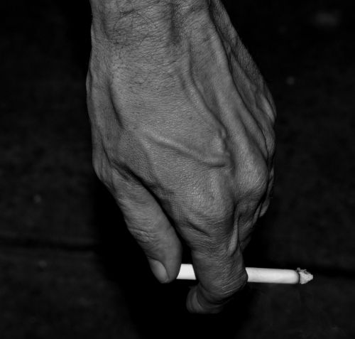 black and white hand cigarette