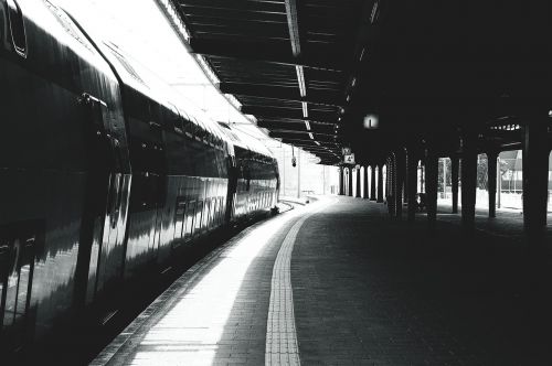 black and white train train station