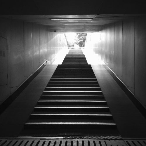 black and white underground passage stairs