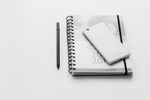 black and white notebook pen