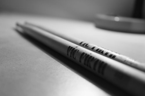 black and white drumsticks wooden