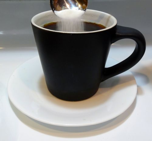 black coffee cup coffee sugar and spoon