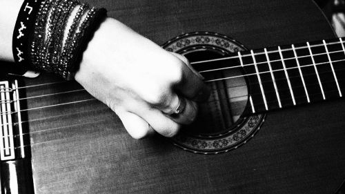black white hand guitar