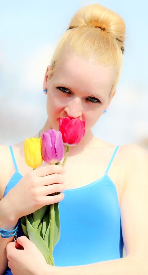 blonde girl beauty tulips