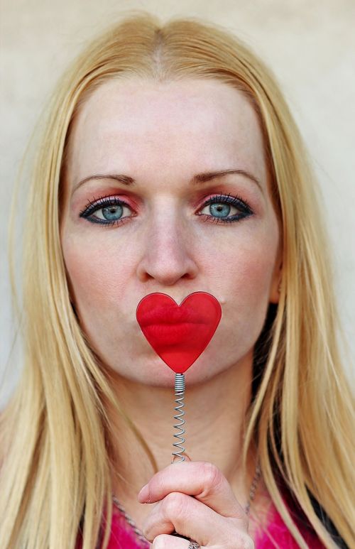 blonde woman heart send kisses