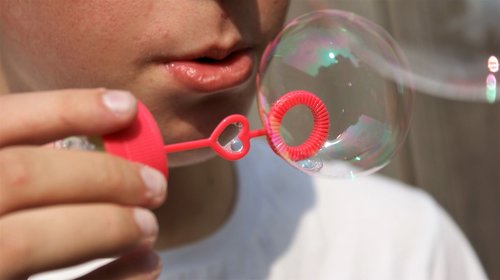 blow bubbles  child  mouth