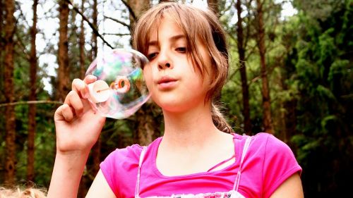 blow bubbles girl pink