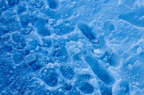blue snow footprints