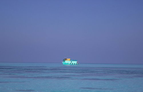 blue boat at sea  ferry  boat