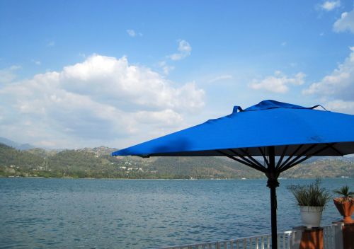 Blue Parasol And Lake