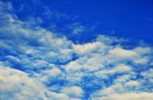 Blue Sea Sky With White Clouds