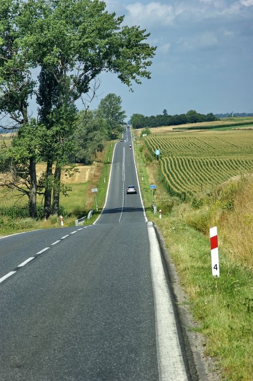 blue sky clouds road