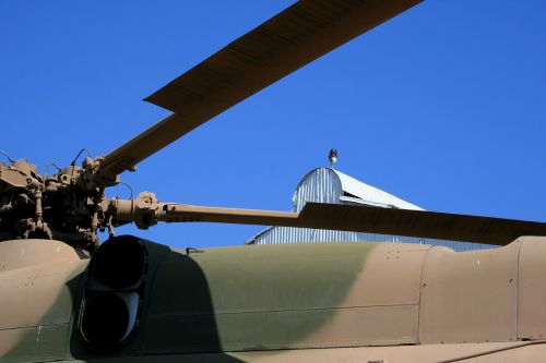 blue sky roof of helicopter blades of helicopter