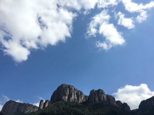 blue sky cliff white cloud