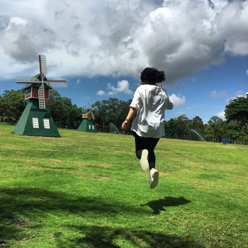 blue sky and white clouds grassland jumping