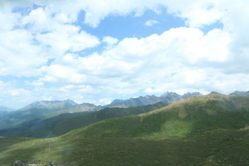 blue sky and white clouds the scenery mountains