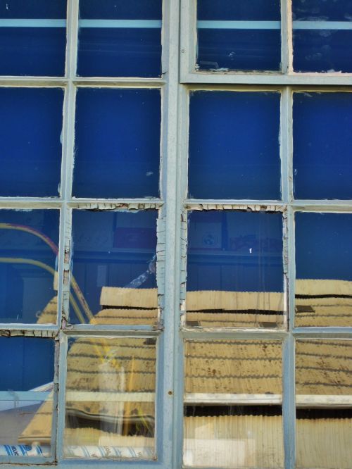 Blue Sky Reflecting In Window