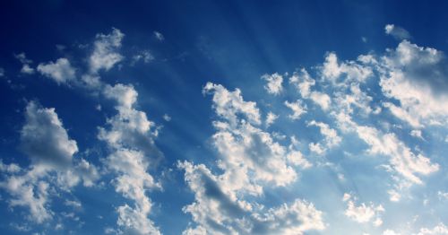 Blue Sky With Clouds And Rays