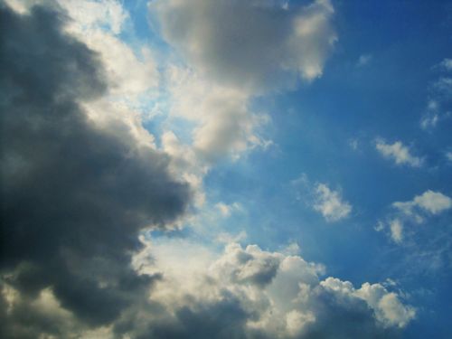 Blue Sky With Shimmering Clouds